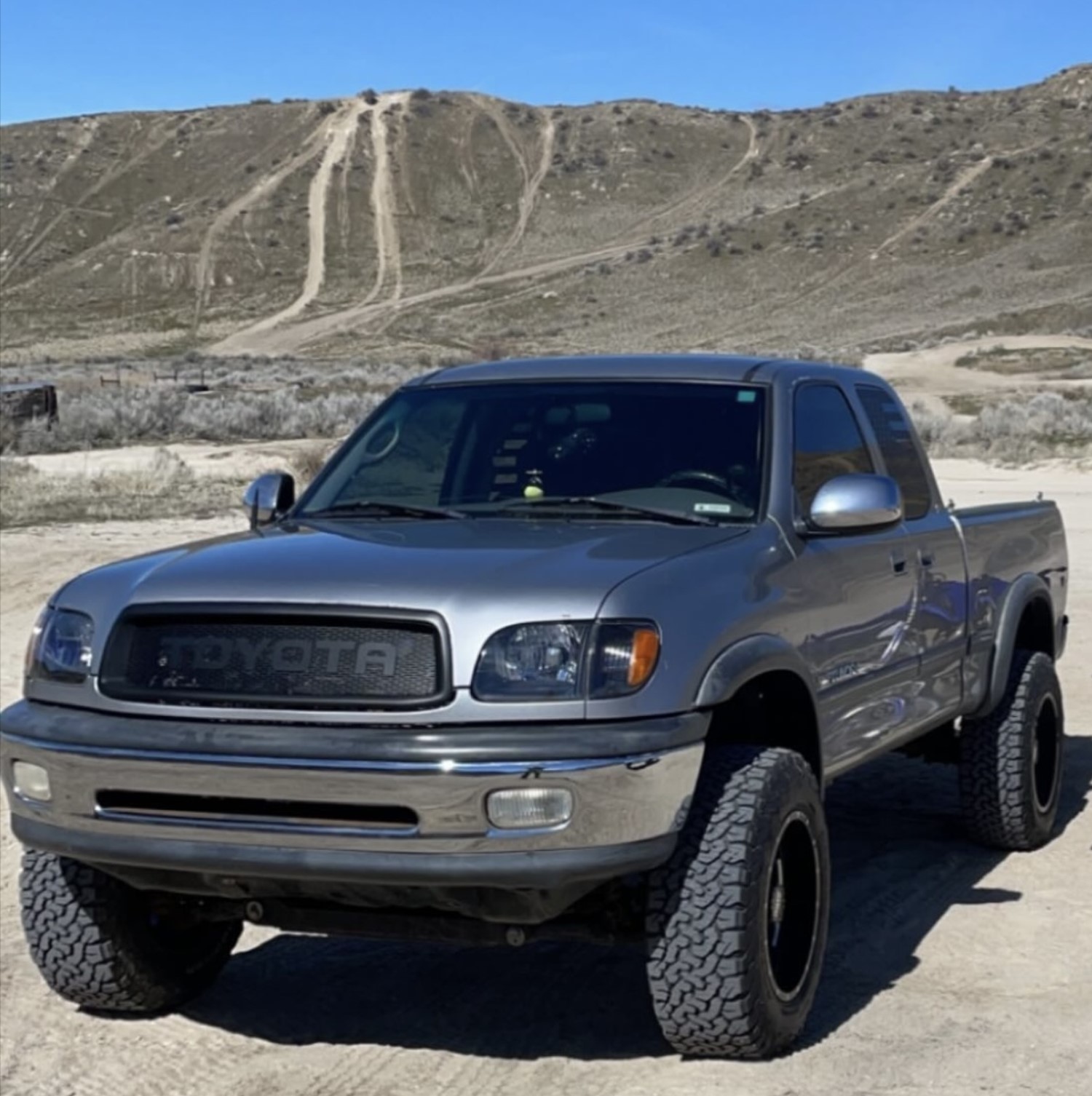 Rugged and Stealthy: First Gen Toyota Tundra in the Desert with Flat Black Grille
